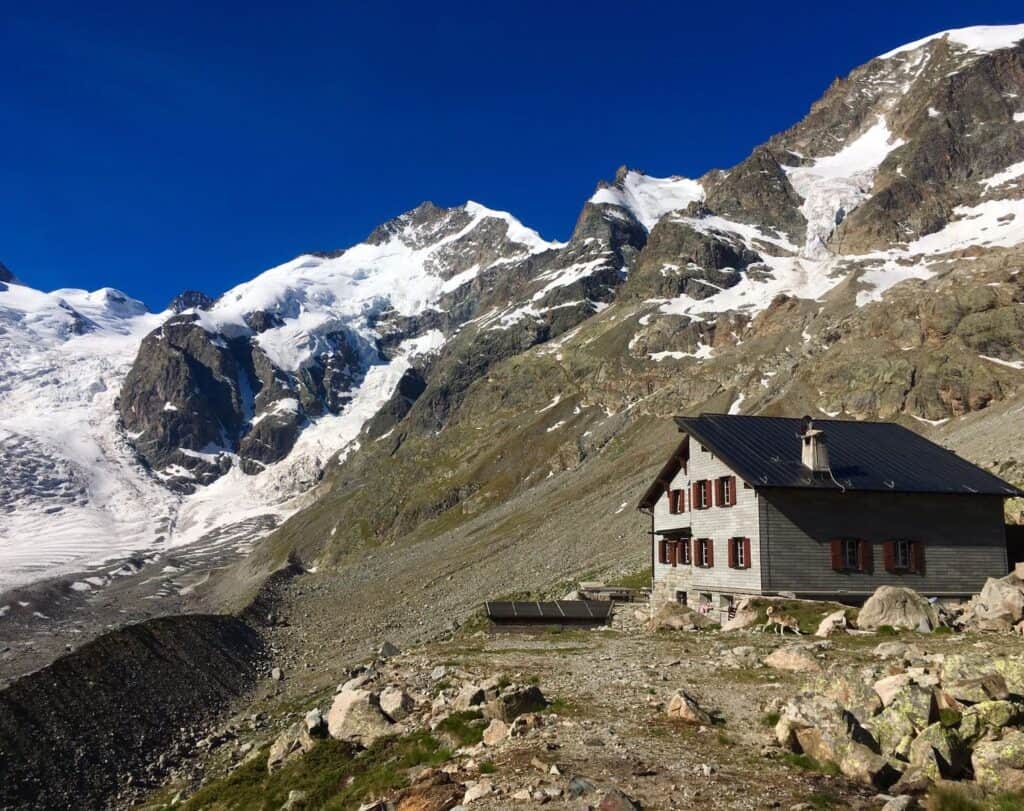 The Boval hut with Bianco Grat and Piz Bernina in the background